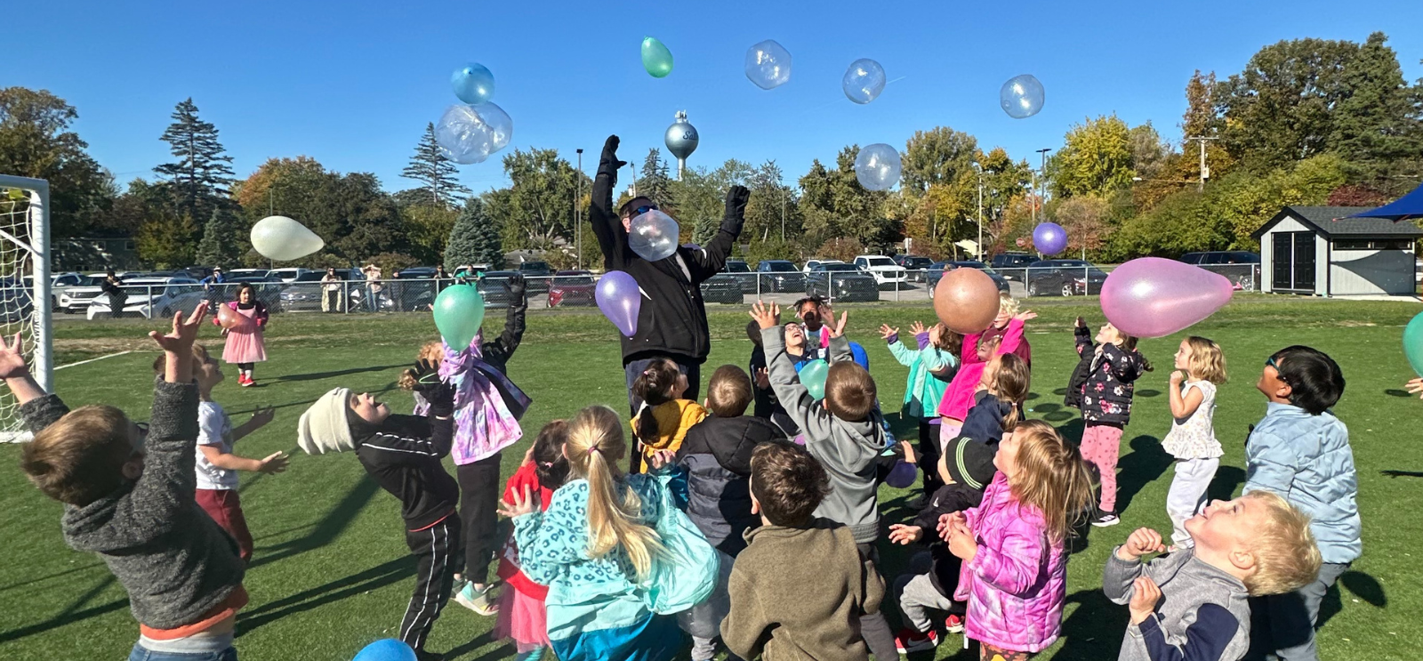 Staff and students playing with balloons