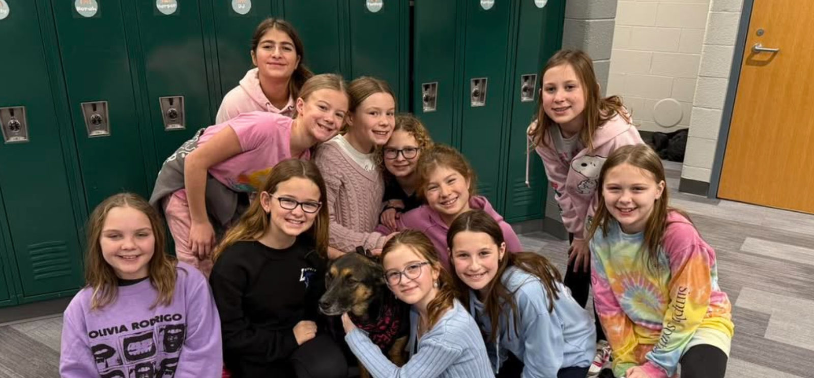 Heritage student posing with therapy dog Kona