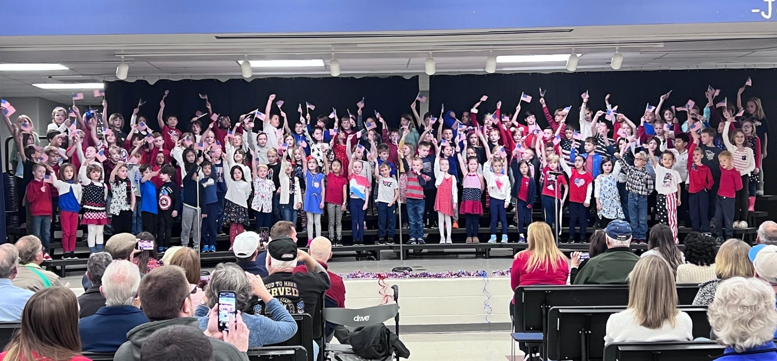 Woodland Meadows students performing for Veterans Day on the stage